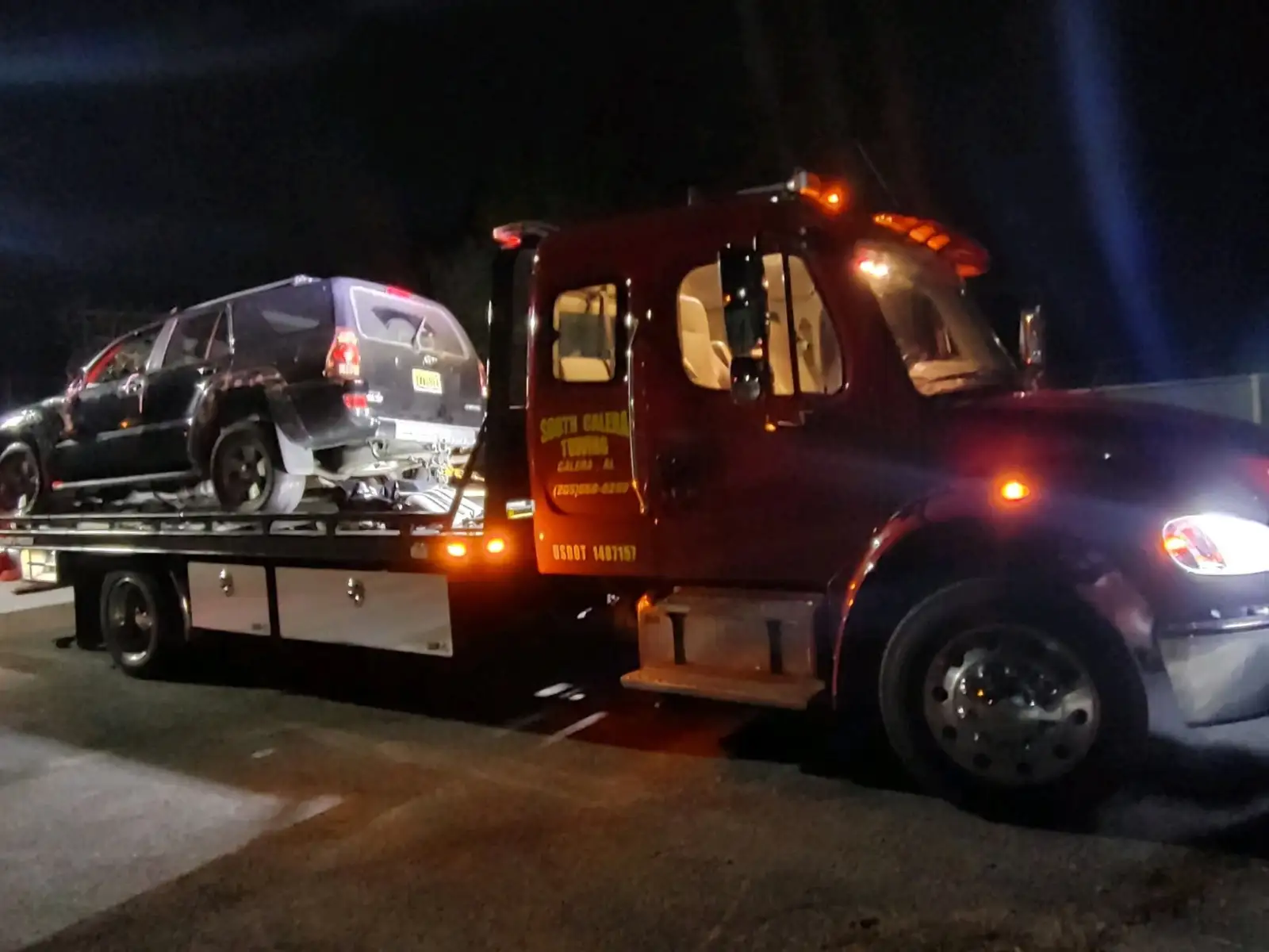 Night tow of a damaged SUV