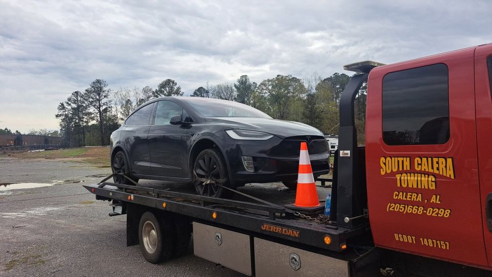 Tesla Towed on the Flatbed