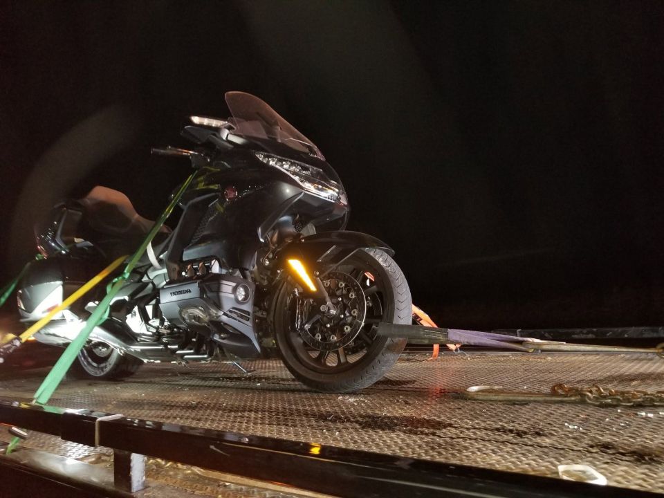 Touring Motorcycle Towed at Night